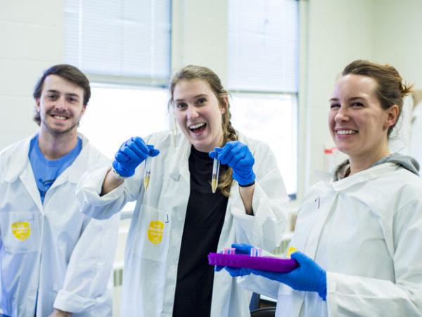 a group of people in lab coats
